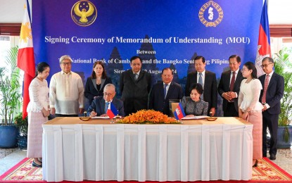 <p><strong>ENHANCED COOPERATION.</strong> Bangko Sentral ng Pilipinas Governor Eli Remolona Jr. (left) and H.E. Dr. Chea Serey, Governor of the National Bank of Cambodia, sign a memorandum of understanding to foster closer cooperation in Siem Reap, Cambodia on Monday (Aug. 19, 2024). The signing ceremony was followed by a high-level bilateral meeting. <em>(Photo courtesy of BSP)</em></p>