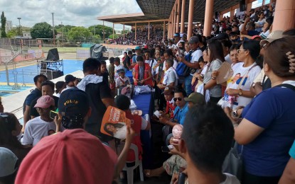 <p><strong>ASSISTANCE.</strong> Some 7,500 of the 13,500 recipients of government assistance join the first day of the two-day payout at the Iloilo Sports Complex in La Paz district on Wednesday (Aug. 21, 2024). Uswag Ilonggo party-list Rep. James "Jojo" Ang said, "As long as we have funds, we will give it back to the people." <em>(PNA photo by PGLena)</em></p>