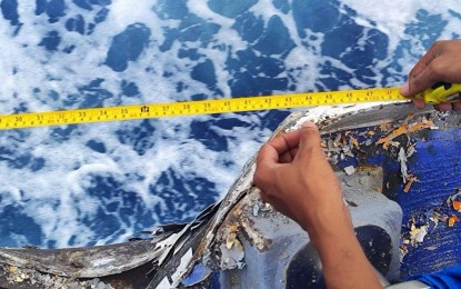 <p><strong>DAMAGED.</strong> A Philippine Coast Guard officer measures the damage incurred by one of its ships from the China Coast Guard's dangerous manuevers which resulted in a collision near the Escoda Shoal on Aug. 19, 2024. The National Security Council on Wednesday (Aug. 21, 2024) said National Security Adviser Eduardo Año briefed US National Security Adviser Jake Sullivan on China's latest acts of harassment during a phone conference on Aug. 20. <em>(Photo courtesy of PCG)</em></p>