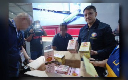 <p><strong>ILLICIT VAPES</strong>. Bureau of Internal Revenue Commissioner Romeo Lumagui Jr. shows some of the confiscated illicit vape products during a raid at the Philippine Vape Festival 2024 on Sunday (Aug. 18, 2024) in Las Piñas City. The BIR confiscated 5,385 illicit vapes, all of which have no internal revenue stamps. <em>(Photo from BIR)</em></p>