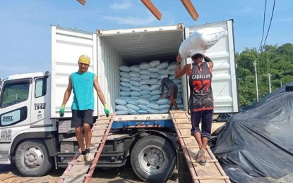 <p><strong>DELIVERY</strong>. Workers load bags of agricultural-grade salt fertilizer at the Pangasinan Salt Center in Barangay Zaragosa Bolinao town, Pangasinan in this undated photo. Pangasinan is now supplying salt fertilizer to Albay, Iloilo, Cebu, Leyte, and Davao through a private contractor. <em>(Photo courtesy of Province of Pangasinan)</em></p>