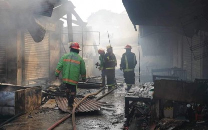 <p><strong>FIRE OUT</strong>. Firefighters put out the blaze at the old public market in San Carlos City, Pangasinan on Thursday (Aug. 22, 2024). The fire, extinguished <span dir="ltr">at 9 a.m.</span>, destroyed an estimated PHP24 million worth of properties and products. <em>(Photo courtesy of San Carlos City Information Office)</em></p>