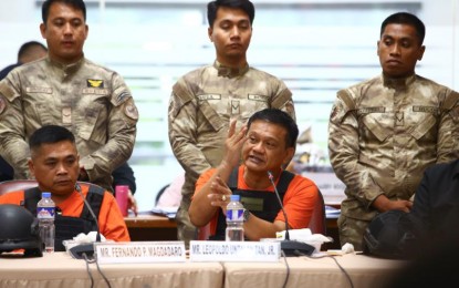 <p><strong>KILLINGS ADMITTED</strong>. Quad Committee resource persons Fernando Magdadaro (seated, left) and Leopoldo Tan Jr., persons deprived of liberty from the Bureau of Corrections, answer questions from House members during the committee hearing at the People's Center in the House of Representatives on Thursday (Aug. 22, 2024). Magdadaro and Untalan admitted to the killing of three Chinese drug lords Chu Kin Tung, alias Tony Lim; Li Lan Yan, alias Jackson Li; and Wong Meng Pin, alias Wang Ming Ping inside a prison cell in Davao Prison and Penal Farm in August 2016. <em>(PNA photo by Joan Bondoc)</em></p>