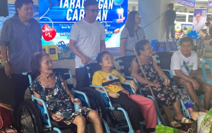 <p><strong>FREE HEALTHCARE SERVICES</strong>. Ako Bicol Party-list Rep. Raul Angelo Bongalon (2nd from left) pose with beneficiaries of the free wheelchairs distributed during the one-day medical-dental mission dubbed "Tarabangan Caravan" in Barangay 13, Bacacay, Albay on Friday (Aug. 23, 2024). The activity is the 18th medical and dental mission that is conducted by the party list throughout the Bicol region. <em>(PNA photo by Connie Calipay)</em></p>