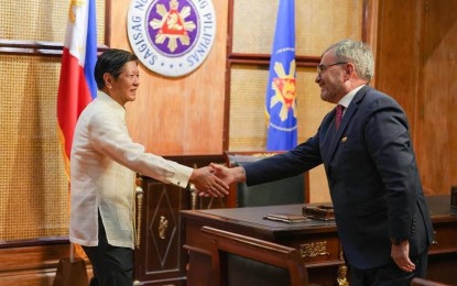 <p><strong>CONFERMENT OF AWARD.</strong> President Ferdinand R. Marcos Jr. (left) shakes hands with outgoing European Union (EU) Ambassador to the Philippines Luc Véron at Malacañan Palace in Manila on Thursday (Aug. 22, 2024). During the farewell call, Marcos thanked Véron for his key role in strengthening the relations between the Philippines and the EU. <em>(Photo from PBBM’s official Facebook page)</em></p>