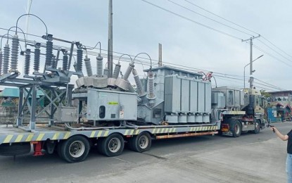 <p><strong>POWER AUGMENTATION.</strong> The 10 megavolt amperes mobile substation of MORE Power Iloilo arrives in Bacolod City on Saturday afternoon (Aug. 24, 2024). It will be installed at the Alijis substation, whose 30/37 MVA power substation broke down on Aug. 21, causing a massive power outage that affected more than 40,000 registered consumer households in the southeastern part of Bacolod. <em>(Photo courtesy of Negros Power and Electric Corp.)</em></p>