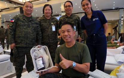 <p><strong>GIFT OF LIFE.</strong> Philippine Army commander Lt. Gen Roy Galido (center, seated) donates blood during the Philippine Army-wide blood donation drive in Fort Bonifacio, Taguig City on Sunday (Aug. 25, 2024). The activity was held in commemoration of National Heroes' Day.⁩ <em>(Photo courtesy of the Philippine Army)</em></p>