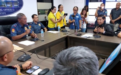 <p><strong>DIALOGUE.</strong> Police Regional Office-11 chief Brig. Gen. Nicolas Torre III (holding mic) and Kingdom of Jesus Christ counsel Israelito Torreon (right) hold a dialogue at the police headquarters in Buhangin, Davao City on Tuesday (Aug. 27, 2024). They discussed the salient points of the temporary protection order issued by the Davao City lower court to remove blockades and cease from restricting the movements of members. <em>(PNA photo by Robinson Niñal Jr.)</em></p>