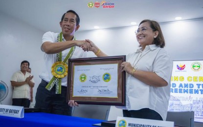 <p><strong>FORGED TIES</strong>. Baybay City, Leyte Mayor Jose Carlos Cari and Guiuan, Eastern Samar Mayor Annaliza Kwan meet at the Guiuan town hall on Tuesday (Aug. 27, 2024). The two officials forged a sisterhood agreement to enhance local governance<em>. (Photo courtesy of Baybay City LGU)</em></p>