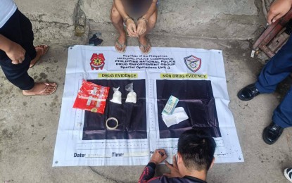 <p><strong>STING OP.</strong> A police officer accounts for illegal drugs seized during a buy-bust operation in Barangay H-2, Dasmariñas City, Cavite on Tuesday (Aug. 27, 2024). The PDEG on Wednesday (Aug. 28) said the suspect, alias 'Tomboy', yielded PHP1.36 million worth of shabu during the operation. <em>(Photo courtesy of PDEG)</em></p>