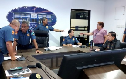 <p><strong>CLARIFICATION.</strong> Officials of the Police Regional Office (PRO) 11 (Davao), led by its chief Brig. Gen. Nicolas Torre III (2nd from left), and counsel for the representatives of the Kingdom of Jesus Christ Israelito Torreon (seated, right) hold a dialogue at the police headquarters in Buhangin, Davao City on Tuesday (Aug. 27, 2024). PNP Director for Police Community Relations, Brig. Gen. Roderick Augustus Alba, said Wednesday (Aug. 28, 2024) that personnel of the respective PROs of Northern Mindanao, Soccksargen, and Caraga have been deployed to augment the civil disturbance management force of PRO-11 in the ongoing search for Pastor Apollo Quiboloy. <em>(PNA photo by Robinson Niñal Jr.)</em></p>