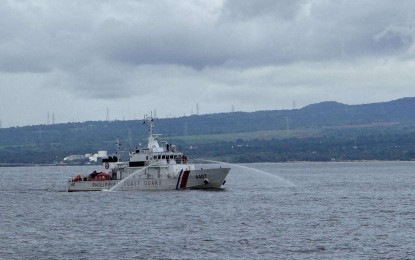 <p><strong>OIL SHEEN AGITATION</strong>. The Philippine Coast Guard's (PCG) BRP Sindangan uses water cannons against some oil sheen near the sunken MTKR Terranova in Bataan waters on Wednesday (Aug. 28, 2024). The PCG said oil siphoning from MTKR Terranova has so far collected 806,254 liters of oily waste.<em> (Photo courtesy of PCG)</em></p>