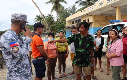 <p><strong>SURVIVOR.</strong> Arnel Belleca (center, in black and green shirt), one of the 10 survivors of two motor bancas that capsized while en route to Caluya Island, Antique from Boracay Island in Aklan, reunites with his family in Romblon on Thursday (Aug. 29, 2024). Rescue operations continue for seven missing passengers. <em>(Photo from San Jose, Romblon Public Information Office)</em></p>