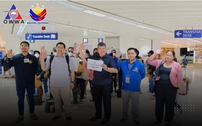 <p><strong>BACK HOME.</strong> The third batch of overseas Filipino workers (OFWs) arrives in the country on Thursday (Aug. 29, 2024) from Laos via Philippine Airlines flight number PR733.  In its Facebook post, the Overseas Workers Welfare Administration (OWWA) said the batch, composed of nine women and 14 men, was among the 73 Filipinos who were victimized by human trafficking and illegal recruitment in Laos, and rescued by the government.<em> (Photo courtesy of OWWA)</em></p>