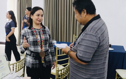 <p><strong>INCREASING AWARENESS.</strong> Lawyer Mabel Balanquit, of the Office for Overseas Voting at the Commission on Elections Central Office, discusses how the Philippine Open Government Partnership campaign platform has helped boost the number of overseas voter registrations for next year’s midterm elections during an interview at the Philippine Open Government Partnership event in Butuan City on Friday (Aug. 30, 2024). Registered overseas voters have increased from 1,069,000 to over 1.2 million as of August.<em> (Photo courtesy of PIA-13)</em></p>