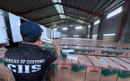 <p><strong>ILLEGAL.</strong> Agents of the Bureau of Customs and Customs Intelligence and Investigation Service-Manila International Container Port raid a warehouse in Meycauayan, Bulacan, reportedly storing imported goods without payment of correct duties and taxes, in this undated photo. The Bureau of Customs have seized over PHP50 billion worth of smuggled items from January to August this year, according to its report on Friday (Aug. 30, 2024). <em>(Photo courtesy of BOC)</em></p>