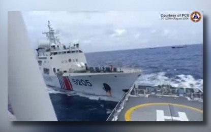 <p><strong>BULLYING TACTIC.</strong> A China Coast Guard vessel (left) rams into Philippine Coast Guard’s BRP Teresa Magbanua in Sabina (Escoda) Shoal, about 75 nautical miles from Palawan, Saturday afternoon (Aug. 31, 2024). PCG spokesperson for the West Philippine Sea Commodore Jay Tarriela said China carried out the dangerous maneuvers despite being unprovoked. <em>(Screenshot from PCG video)</em></p>