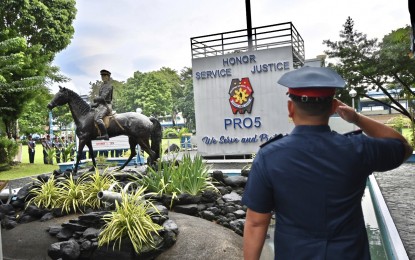 <p><strong>HONOR</strong>. Police Regional Office-Bicol (PRO5) Regional Director Brig. Gen. Andre Dizon salutes to the monument of Brig. Gen. Simeon A. Ola inside the camp named after the Albayano hero on Monday (Sept. 2, 2024). Sept. 2 of every year is a special non-working holiday in Albay province, including the cities therein, in commemoration of the birth anniversary of Ola and in recognition of his service and bravery, being the last Filipino army general who surrendered to the American forces after the Philippine-American war in the early 1900s<em>. (Photo courtesy of PRO5)</em></p>