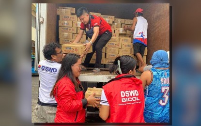 <p><strong>AID DISTRIBUTION</strong>. Department of Social Welfare and Development (DSWD) staff unload boxes of family food packs for distribution to families affected by Severe Tropical Storm Enteng at the city hall compound in Naga City, Camarines Sur on Sept. 2, 2024. The DSWD on Tuesday (Sept. 9) said it has distributed almost PHP250 million worth of food and non-food items to families hit by Enteng and southwest monsoon or habagat.<em> (Photo courtesy of DSWD-Bicol)</em></p>