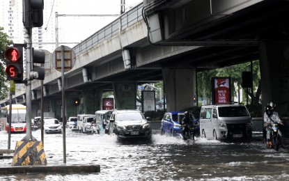 <p><strong>WATER WORLD</strong>. Motorists pass through gutter-deep floods triggered by Tropical Storm Enteng along Taft Avenue and UN Avenue in Manila on Tuesday (Sept. 3, 2024). President Ferdinand R. Marcos Jr. has tasked local government units to lead the response to the onslaught of Enteng while national government agencies should remain ready to render the necessary assistance. <em>(PNA photo by Yancy Lim)</em></p>