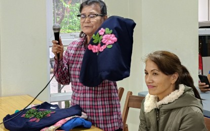 <p><strong>LIVELIHOOD AID</strong>. Former overseas Filipino worker Amelie Rimorin (left) shares how she used the livelihood assistance she received from the Department of Migrant Workers after she settled back in the country in 2022, during the Bagong Pilipinas press briefing in Baguio City on Tuesday (Sept. 3, 2024). The department has provided livelihood assistance to 170 former overseas Filipino workers based in the Cordillera region since 2022. <em>(PNA photo by Liza T. Agoot)</em></p>