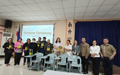 <p><strong>DONATION</strong>. Baguio City Mayor Benjamin Magalong and Department of Education Baguio City Acting Schools Division Superintendent Dr. Soraya Faculo (11th and 12th from left) witness the turnover of 140 chairs, five teachers’ tables and 242 gallons of paint to school heads in the city on Tuesday (Sept. 3, 2024). The donation came from a school acquired by San Miguel Corporation in Pampanga province. <em>(PNA photo by Liza T. Agoot</em>)</p>