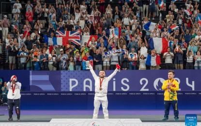 <p><strong>TICKET SALES</strong>. Gold medalist Charles Noakes (C) of France, silver medalist Krysten Coombs (L) of Britain and bronze medalist Vitor Tavares of Brazil react during the awarding ceremony after the men's singles SH6 gold medal match of para badminton at the Paris 2024 Paralympic Games in Paris, France on Sept. 2, 2024. Organizers on Monday said ticket sales of the Paris 2024 Paralympic Games have reached 2.3 million after the weekend. <em>(Xinhua/Cai Yang)</em></p>