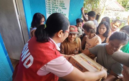 <p><strong>FOOD AID.</strong> Flood-affected individuals in Allen, Northern Samar receiving family food packs from the Department of Social Welfare and Development (DSWD) in this Sept. 2, 2024 photo. The DSWD has provided 6,482 family food packs to families in Northern Samar displaced by widespread flooding due to Tropical Storm Enteng<em>. (Photo courtesy of DSWD Region 8)</em></p>