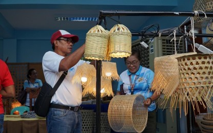 <p><strong>BAMBOO PRODUCTS</strong>.  Visitors check bamboo products inside the display center in Laoag City, Ilocos Norte province that opened on Wednesday (Sept. 4, 2024). The center showcases the finished products made by members of the Balatong  Bamboo Weavers Association, which is being assisted by the city government and other government agencies. <em>(Photo courtesy of the city government of Laoag)</em></p>