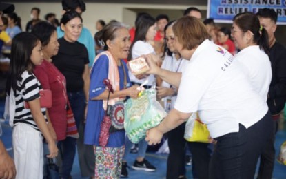 <p><strong>GRATEFUL</strong>. An elderly resident of Antipolo City, among those affected by Severe Tropical Storm Enteng, receives assistance from the Land Transportation Office-Calabarzon at the covered court of Barangay Inarawan on Friday (Sept. 6, 2024). The aid was given under the agency's Calabarzon Assistance & Relief Efforts progam<em>. (Photo courtesy of LTO-Calabarzon) </em></p>