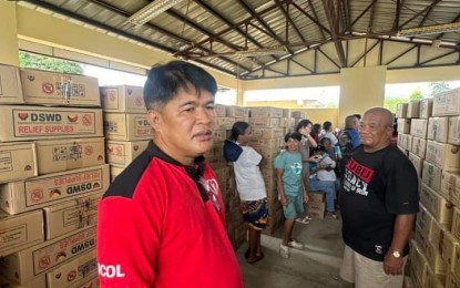 <p><strong>RELIEF AUGMENTATION</strong>. Department of Social Welfare and Development-Bicol Director Norman Laurio supervises the distribution of family food packs to families affected by Severe Tropical Storm Enteng. As of Friday morning (Sept. 6, 2024), DSWD-Bicol had already distributed 61,736 family food packs worth over PHP43 million in the six provinces of the region<em>. (Photo courtesy of DSWD-Bicol)</em></p>