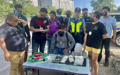 <p><strong>BIG DRUG HAUL.</strong> A 17-year-old suspect (signing a document) who hails from Ubay, Bohol yields two kilos of shabu worth PHP13.6 million to agents of the Philippine Drug Enforcement Agency-Central Visayas in Mandaue City, Cebu on Friday (Sept. 6, 2024). PDEA said the suspect is a new player in Central Visayas. <em>(Photo courtesy of PDEA-7)</em></p>