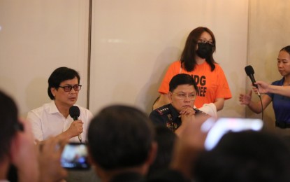 <p><strong>BACK TO FACE CHARGES.</strong> Department of the Interior and Local Government Secretary Benhur Abalos Jr. (left) and Philippine National Police (PNP) chief Gen. Rommel Marbil present dismissed Bamban, Tarlac Mayor Alice Guo (standing) to the media at the Royal Star Aviation Hangar in Pasay City early Friday (Sept. 6, 2024). The former mayor is facing a string of charges in the Philippines such as human trafficking, tax evasion, and money laundering. <em>(PNA photo by Avito Dalan)</em></p>