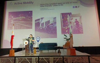 <p><strong>ECO FORUM.</strong> National Economic and Development Authority specialist Roxanne Yap talks about sustainable transport, green sidewalks, and active mobility during an economic forum in Iloilo City on Friday (Sept. 6, 2024). She said Western Visayas, including Iloilo City, has a lot of sustainable transport on the roads, including electric tricycles and electric buses. <em>(PNA photo by PGLena)</em></p>