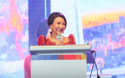 <p><strong>TOURIST ARRIVAL</strong>. Tourism Secretary Christina Frasco delivers her speech during the opening of the 35th Philippine Travel Mart (PTM) at SMX Convention Center in Pasay City on Friday (Sept. 6, 2024). Frasco said the Philippines is halfway through its arrival target for the end of 2024 after recording 4.08 million international visitors as of Sept. 5. <em>(Photo courtesy of DOT)</em></p>