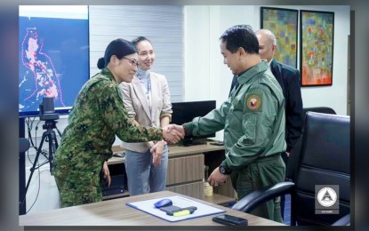 <p><strong>BOOSTING DISASTER RESPONSE.</strong> Office of Civil Defense administrator Undersecretary Ariel Nepomuceno (right) shakes hands with a representative of the Japan Ground Self-Defense Force during a courtesy call in Camp Aguinaldo, Quezon City on Sept. 3, 2024. The OCD on Friday (Sept. 6) said it is committed to further strengthening ties with Japan in the field of disaster risk reduction and management. <em>(Photo courtesy of OCD)</em></p>