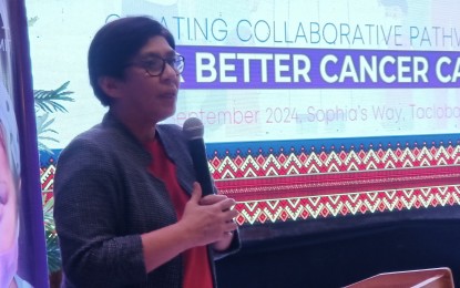 <p><strong>FIGHTING CANCER</strong>. Department of Health Undersecretary Maria Rosario Vergeire speaks during the National Integrated Cancer Control Act localization summit for Eastern Visayas in Tacloban City on Sept. 6, 2024. She said the country needs more cancer specialists, such as oncologists and radiation oncologists, to cater to the health care needs of cancer patients. <em>(PNA photo by Roel Amazona)</em></p>