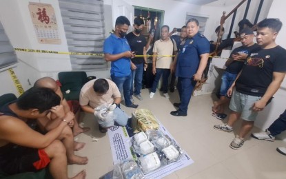 <p><strong>BIG HAUL. </strong>PNP Drug Enforcement Gorup chief Brig. Gen. Eleazar Matta (center, standing) oversees the buy-bust operation in Imus, Cavite on Monday night (Sept. 9, 2024). Two suspects yielded a total of 110 kg. of shabu with an estimated street value of PHP748 million during the operation. <em>(Photo courtesy of PDEG)</em></p>