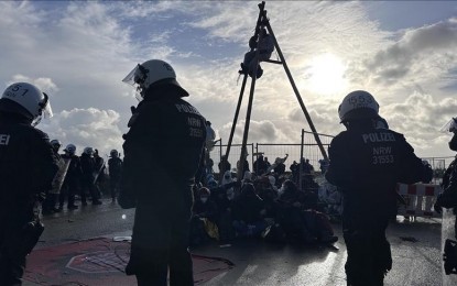 <p>Climate activists chained themselves as the police begin move environmental activists away during their protest to stop the expansion of a coal mine in Lutzerath, Germany in January 2023. <em>(Anadolu)</em></p>