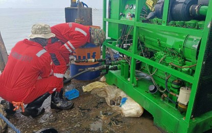 <p><strong>OILY WASTE PUMP.</strong> Personnel of Harbor Star --the contracted salvor for MTKR Terranova-- worked on a pump that recovers oily waste from the sunken vessel in Bataan waters on Wednesday (Sept. 11, 2024). The PCG said oil siphoning from MTKR Terranova may end as early as Friday (Sept. 13) after collecting around 1.4 million liters of oily waste. <em>(Photo courtesy of PCG)</em></p>