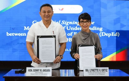 <p><strong>CLASSROOM REPAIRS.</strong> Education Secretary Sonny Angara (left) inks a partnership with Landbank of the Philippines (LandBank) President Lynette Ortiz for the funding of repairs of disaster-affected classrooms in 12 last-mile schools on Wednesday (Sept 11, 2024). Besides the repair of disaster-affected schools, the LandBank also committed to help link DepEd with other banks for the Adopt-a-School Program. <em>(Photo courtesy of DepEd)</em></p>