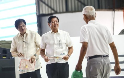 <p><strong>DEBT CONDONATION.</strong> President Ferdinand R. Marcos Jr. (center) leads the distribution of Certificates of Condonation and Release of Mortgage to the Agrarian Reform Beneficiaries in Bulacan during a ceremony at the Department of Agrarian Reform main office in Quezon City on Thursday (Sept 12, 2024), assisted by DAR Secretary Conrado Estrella III. The condonation of all unpaid principal amortizations, interest, and surcharges of ARBs on agricultural lands awarded under the Comprehensive Agrarian Reform Program is mandated under Republic Act 11953 or the New Agrarian Emancipation Act, which Marcos signed into law in July last year. <em>(PNA photo by Joan Bondoc)</em></p>