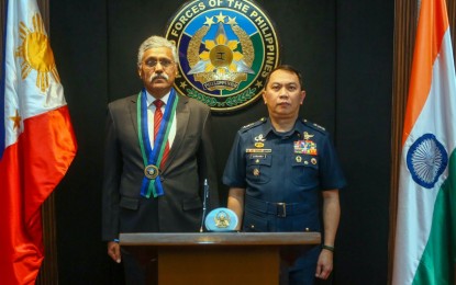 <p><strong>DEEPER DEFENSE TIES.</strong> AFP vice chief of staff, Lt. Gen. Arthur Cordura (right), and Indian Defense Secrerary Shri Giridhar Aramane pose for a photo opportunity during the latter's courtesy visit to the AFP headquarters in Camp Aguinaldo, Quezon City on Wednesday (Sept. 11, 2024). The discussions between the two sides focused on enhancing bilateral defense relations, exploring opportunities for joint training and exercises, and sharing best practices in addressing common security challenges in the Indo-Pacific Region.<em> (Photo courtesy of AFP)</em></p>