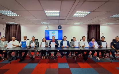 <p><strong>PROTECTA PILIPINAS.</strong> The signing of a memorandum of understanding for the Protect Technology-Telecom Alliance (PROTECTA) Pilipinas in Taguig City on Thursday (Sept. 12, 2024). The public-private alliance seeks to improve the resilience of the country's telecommunications network against disasters and cyberattacks. <em>(Photo courtesy of PLDT-Smart)</em></p>