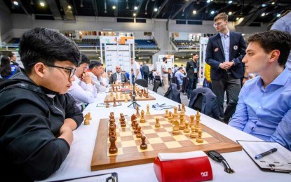 <p><strong>WINNER.</strong> Filipino International Master Daniel Quizon (left) studies his next move against German super Grandmaster Dimitrij Kollars in the second round of the 45th FIDE Chess Olympiad at the BOK Sports Hall in Budapest, Hungary on Thursday (Sept. 12, 2024). Quizon won the match, 3-1, in 54 moves of a Sicilian Defense. <em>(Contributed photo)</em></p>