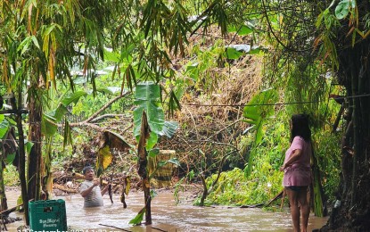 <p><strong>FLOODING.</strong> A man wades through floodwaters in a low-lying village in Siaton, Negros Oriental on Thursday (Sept. 12, 2024). Health authorities have cautioned the public against disease outbreaks such as leptospirosis and dengue during rains and flooding. <em>(Photo courtesy of PDRRMO)</em></p>