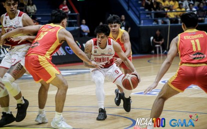 <p><strong>BALL HANDLER.</strong> San Beda University's Bryan Sajonia (No. 9) protects the ball against San Sebastian College's Tristan Felebrico in the National Collegiate Athletic Association Season 100 men's basketball tournament at Filoil EcoOil Centre in San Juan City on Saturday (Sept. 14, 2024). The Red Lions won, 85-75, to improve to 2-1. <em>(NCAA photo)</em></p>