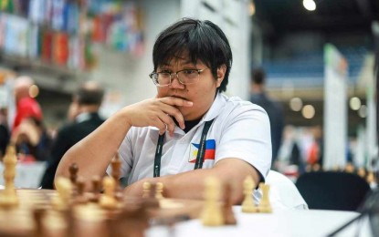 <p><strong>SLICK MOVE.</strong> Filipino Shania Mae Mendoza ponders on her next move against Jordanian Natalie Fuad Kamel Jamaliah in the third round of the 45th FIDE Chess Olympiad at BOK Sports Hall in Budapest, Hungary on Friday (Sept. 13, 2024). Mendoza prevailed after 41 moves of the Sicilian Defense as the Philippines swept Jordan, 4-0. <em>(Contributed photo)</em></p>