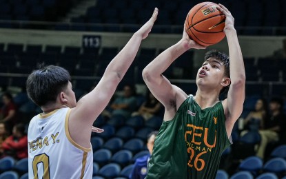 <p><strong>JUMP SHOT.</strong> Far Eastern University's Prince Cariño (No. 26) challenges the defense of National University Nazareth School's Yujin Peña (No. 0) during the UAAP Season 87 juniors basketball tournament at Smart Araneta Coliseum in Quezon City on Saturday (Sept. 14, 2024). The Baby Tamaraws won, 89-71. <em>(UAAP photo)</em></p>