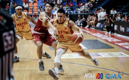 <p><strong>ONE-ON-ONE.</strong> Mapua's Clint Escarmis (with ball) drives past Perpetual's Mark Gojo Cruz in the National Collegiate Athletic Association Season 100 men's basketball tournament at FilOil EcoOil Centre in San Juan City on Sunday (Sept. 15, 2024). The Cardinals won, 71-65.<em> (NCAA photo)</em></p>